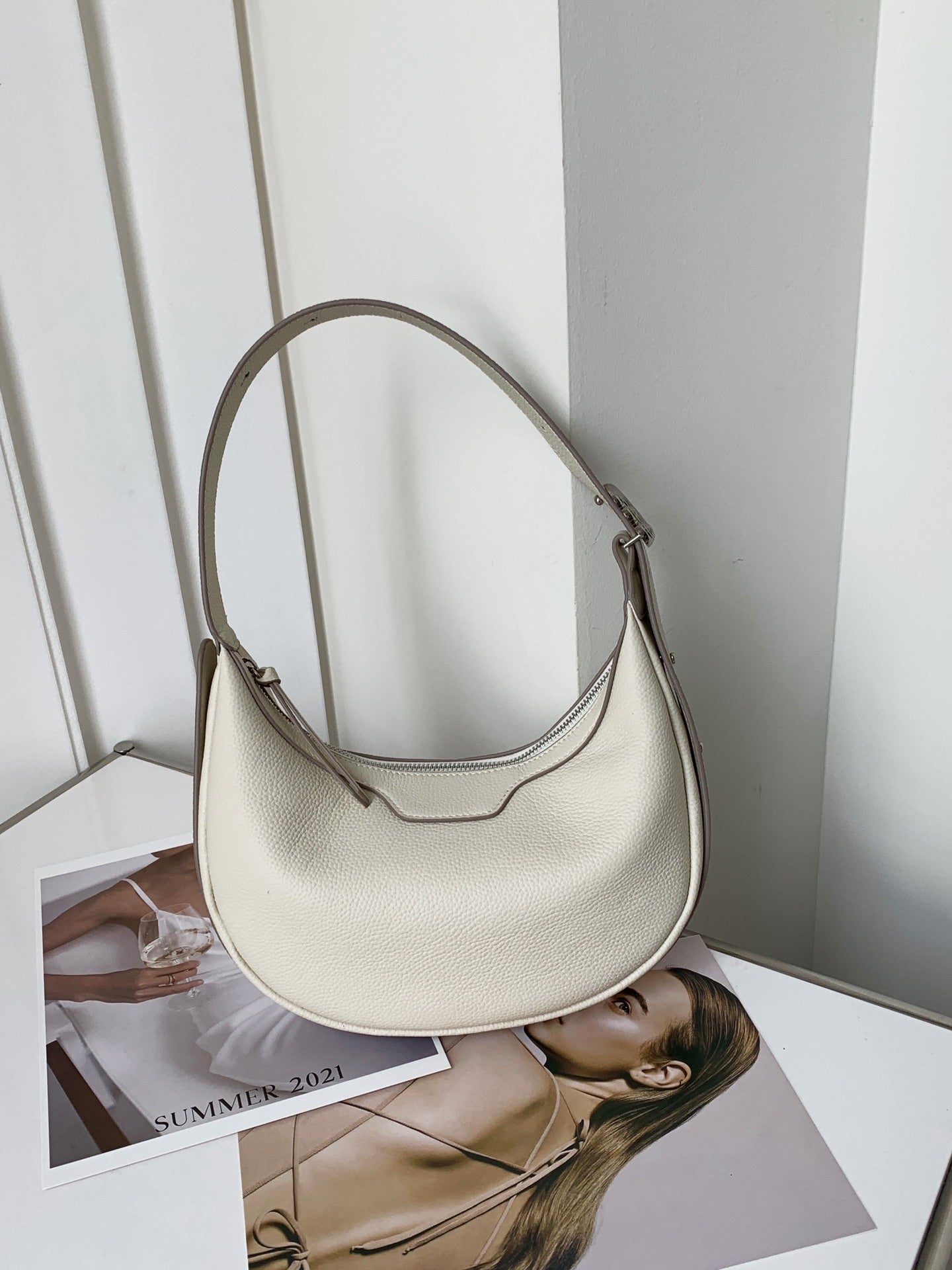 Female half-moon leather bag