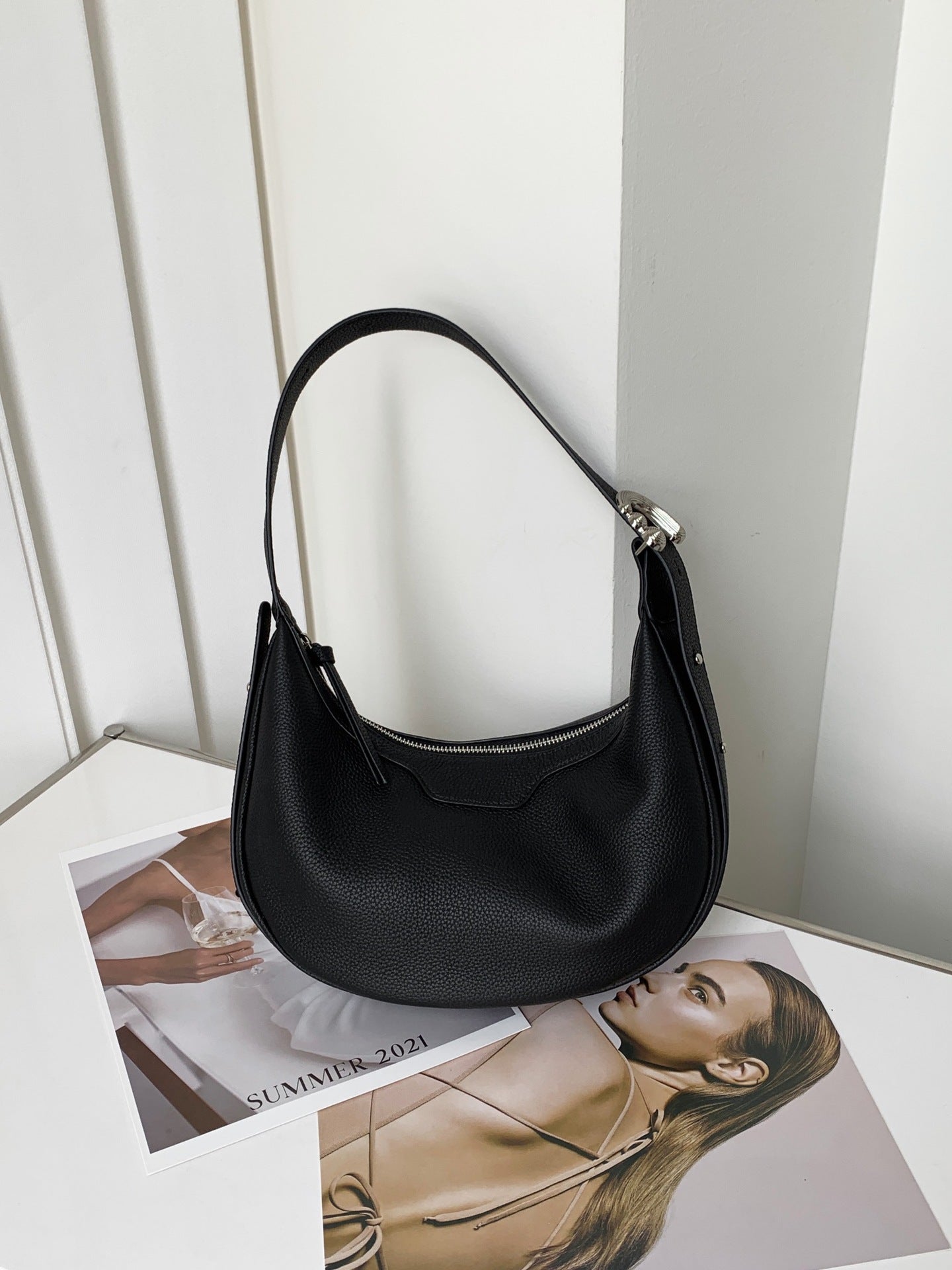 Female half-moon leather bag